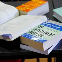 the Intelligent Investor book on table