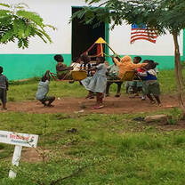 children in Ghana playing on playground