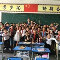 teacher and students in front of classroom in China
