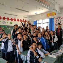 group of students posing in a classroom