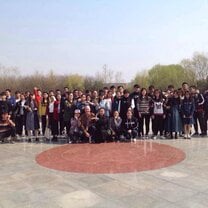 group of teachers posing in a courtyard