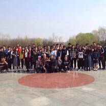 group of teachers posing in a courtyard