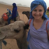 Riding a camel in the Sahara Desert