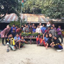 Children posing with their ecological plant pots at the Thanapara Community school