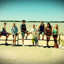 Group photo sitting at railing