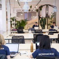 Ironhack students working at computers