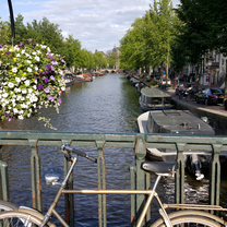 Bike in front of a canal in Amsterdam