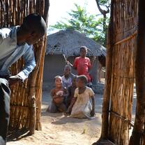 Kalumba wound care - Lovemore (one of the translators) and children waiting to get treated