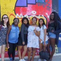 Students in front of street art in Berlin