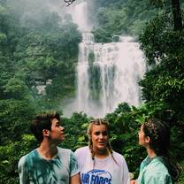 Looking at a waterfall from the vantage of a treehouse deck