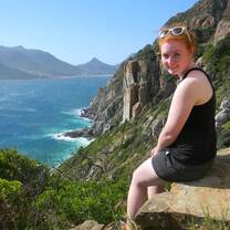 girl sitting at cliffs