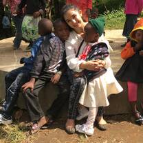 Volunteer with group of kids