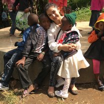 Volunteer with group of kids