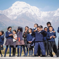 Students stand in front of Annapurna
