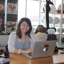girl smiling sitting at computer