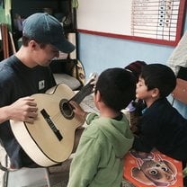 Teaching kids in Stage 3 how to play the Guitar