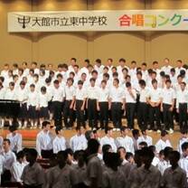 group of kids all wearing white on a stage