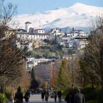 City view of students walking through Granda on a beautiful day