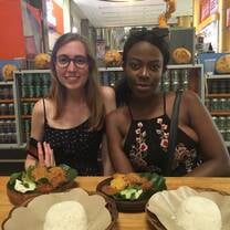 girls sampling local cuisine 