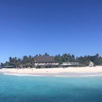 Beachcomber Island surrounded by crystal blue sea