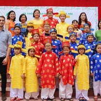 group of kids in matching Chinese cultural outfits