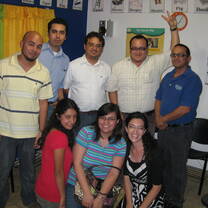group in a classroom smiling