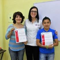 three people holding certificates