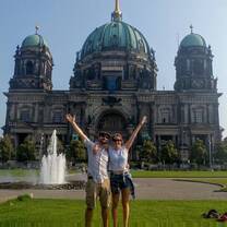 Two interns posing in front of a monument in Berlin, Germany.