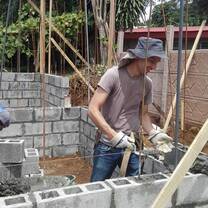 Boy building and working on community project in Costa Rica