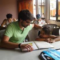 Peru male volunteer teaching student