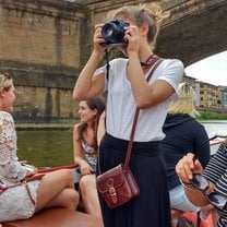 SIA took us on a boat ride down the Arno, and I was captured in my element. Taking photos!