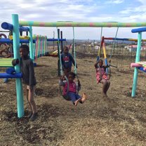 Playing with kids on the playground we made. 
