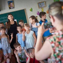 woman teaching kids
