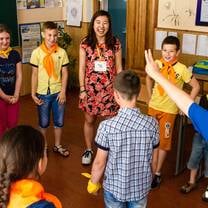 woman teaching kids
