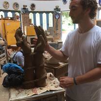 Dylan finishing his ceramics sculpture.