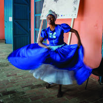 Havana, Cuba dancer twirls in blue dress.