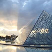 Visit famous cultural sites like the Louvre in Paris