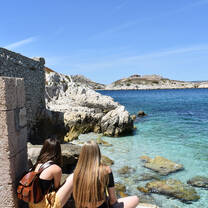 students sitting with Chateau D'If 