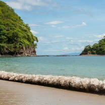 dark sandy beaches of Playas del coco