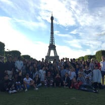 Group photo of students in front of Eiffel Tower