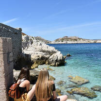 students sitting with Chateau D'If 