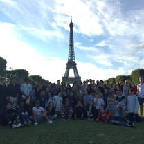 Group photo of students in front of Eiffel Tower