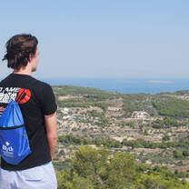 Student looking out over view if a Greek Island