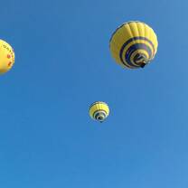 Students up in yellow hot air balloons