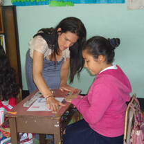 Teaching intern helping student