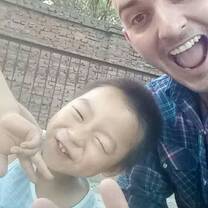 male teacher smiling with student in china