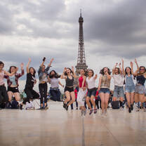 group jumping in front of the Eiffel Tower