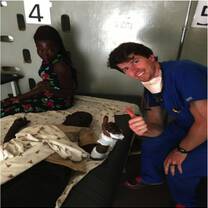 Chris helps a patient with a broken arm at Gulu Regional Referral Hospital.