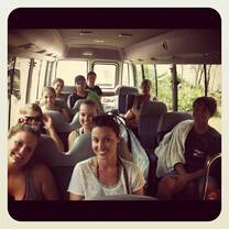 Students in a bus on the way to surf in Australia
