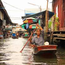 Woman in boat at floating market 